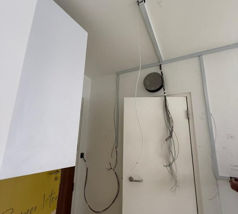 Bathroom ceiling LED light installed with exposed wiring during renovation in Singapore