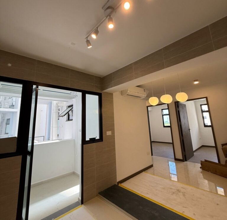 Completed lighting installation with pendant lights and track lights in a renovated Singapore home