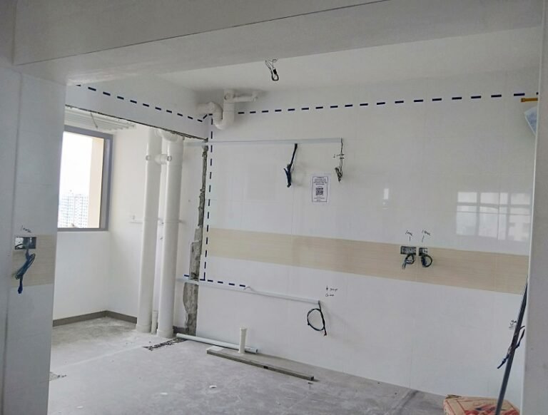 Kitchen wall marked with dotted lines for concealed wiring routes before electrical installation in Singapore