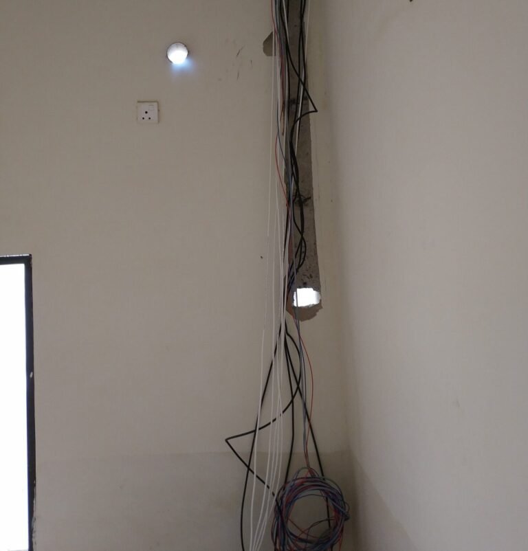 Wiring bundle run to a downlight point on the ceiling of a Singapore home
