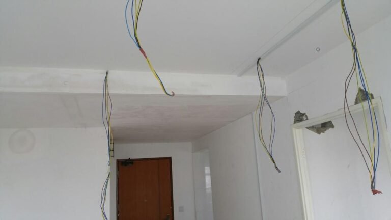 Ceiling cables left at drop points for lighting installation in a renovated Singapore home