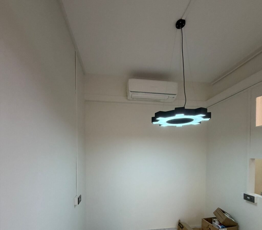 Decorative LED ceiling light and air conditioner installed in a Singapore home