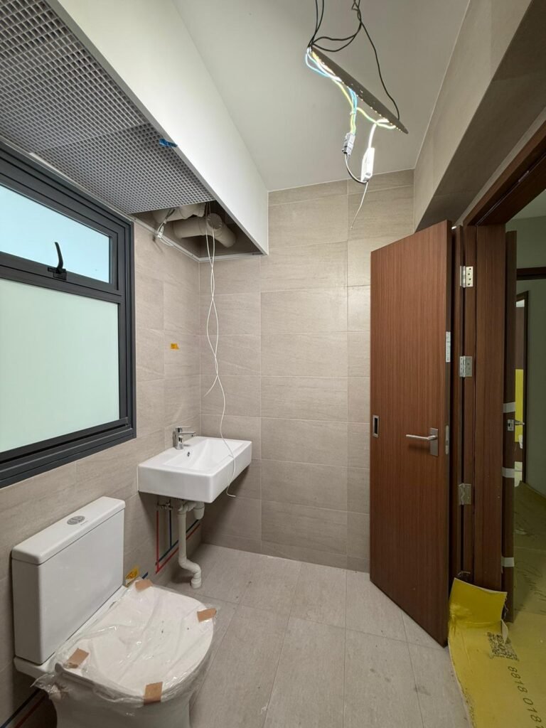 HDB bathroom with wiring points ready for heater and light installation in Singapore