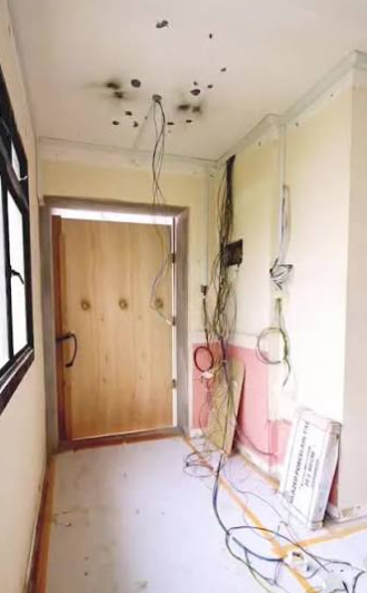 Old house with outdated exposed wiring on walls and ceiling before electrical rewiring in Singapore