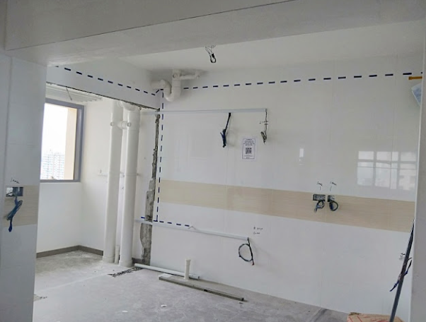 Kitchen wall marked with planned wiring routes before electrical rewiring in a Singapore HDB flat