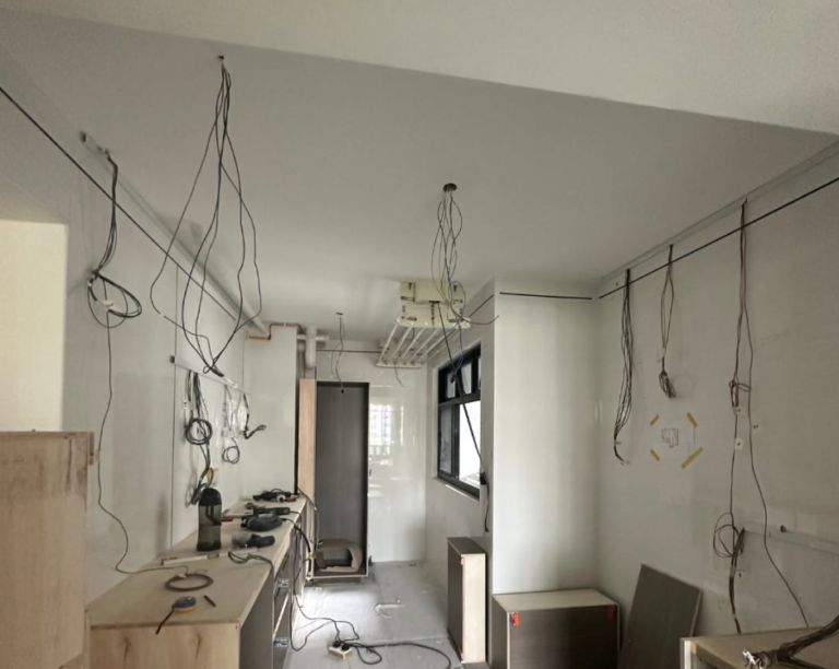 Renovation site with ceiling wiring drops for lights and power points in a Singapore flat