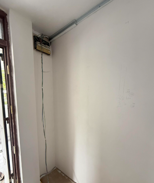 Cable drop from ceiling to a wall switch point during electrical wiring installation in Singapore