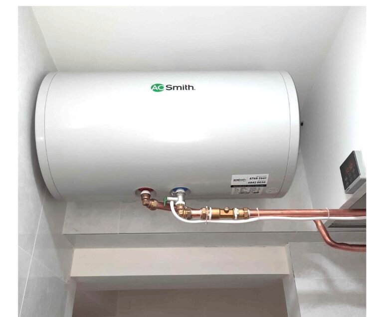 A.O. Smith storage water heater mounted near the bathroom ceiling with copper piping by a Singapore electrician