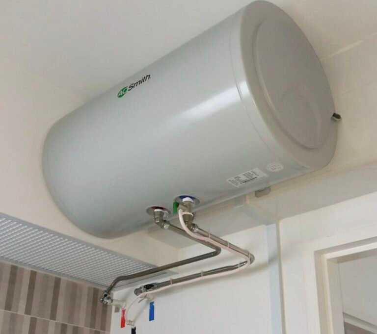 Wall-mounted horizontal storage water heater with stainless steel flexible hose after installation in Singapore