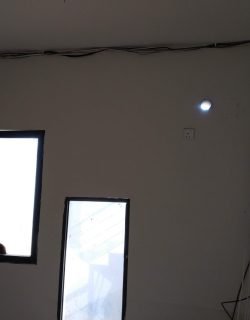 Concealed wiring along the ceiling edge for downlight installation in a Singapore home